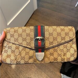GUCCI GG MONOGRAM SUPREME CANVAS CLUTCH